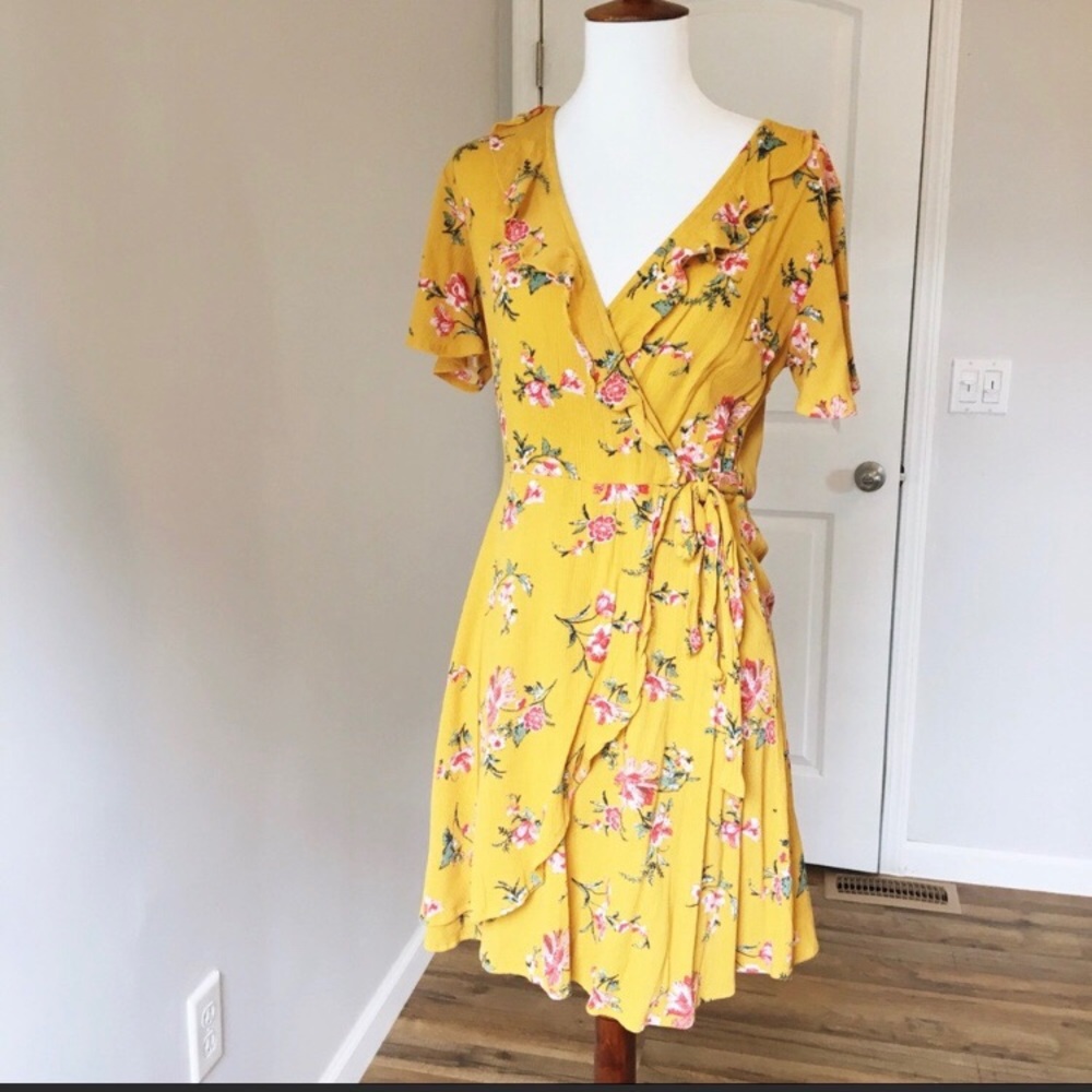 Francesca’s yellow floral wrap dress